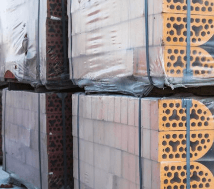 Stretch Film – Stacks of silicate bricks on wooden pallets and in polyethylene Stacks of silicate bricks on wooden pallets and in polyethylene